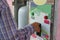 Close up view of hand of human inserting coin in to the old vending machine for refill a plastic water bottle,Shallow depth of fie