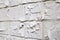 Close up view of hand made gypsum plaster bricks wall light background