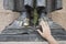 Close up view of hand touching the feet of San Pedro de Alcantara bronze sculpture in CÃ¡ceres, Spain to make wishes. Located