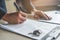 Close-up view hands of businessman signing leasing home documents