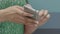 Close Up View On Hands Of Employees Watching Video On Smartphone Indoors