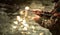 Close-up view of the hands of a fly fisherman working the line and the fishing rod