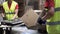 Close-up view of the hands of a manufacturing worker putting packed products in cardboard boxes, before export or