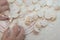 Close-up view of the hands taking homemade potstickers. Motion blur.