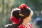 Close up view of the head of two women in flamenco traditional costume