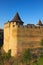 Close-up view of high stone wall with a tower of medieval Khotyn castle. Autumn landscape view. Khotyn. Chernivtsi region.