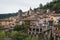 Close up view of historic colorful buildings along the cliff in Pont-en-Royans, France