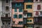 Close up view of historic colorful buildings along the cliff in Pont-en-Royans, France