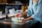 Close up view of a housewife washing up dinner dishes using a soapy sponge