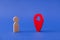 Close-up view of human figure standing near red pointer GPS find search place hotel room hostel booking web app service