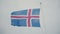 Close-up view of icelandic flag on flagpole on the board of the ship. Flag waving on the wind.