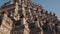 close-up view of the intricate architectural details of the Wat Arun temple in Bangkok, Thailand. The temple's prang