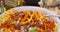 Close up view of Italian pasta spaghetti, linguine with tomato sauce and basil