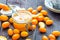 Close Up View of Kumquat Jam in Glass Jar on Dark Wooden Table