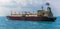 A close up view of a large Liquid Natural Gas tanker ship sailing northward in the Singapore Straits in Asia