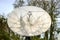 Close up view of a large parabolic telecommunications antenna