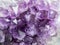 Close up view of large violet amethyst crystal cluster. Esoteric magical background concept.