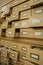 Close up view on library wooden card catalog with opened crates