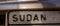 Close-up view of a license plate with the inscription Sudan