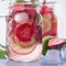 Close up view lime and strawberry detox in glass mason jars macro. Fitness summer drink4