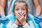 Close up view of a little girl looking scared and terrified screaming covering her mouth from the dentists with medical tools