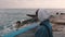 Close up view of lonely girl at marina. Melancholy girl looking at stormy sea. Pessimistic young woman in casual style standing at