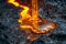 Close-up View of Magma Flow on Volcanic Surface, Glowing Lava Stream in the Dark, Concept of Nature\\\'s Power and Geothermal