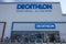 Close up view of main logo of sport market Decathlon on facade of building.
