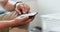 Close-up view of male freelancer hand and his smartphone