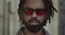 Close up view of man with beard and moustache turning head and looking to camera. Portrait of mixed race guy with