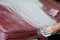 Close up view of a man`s hand sanding the hood of a truck before a paint job