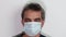 Close up view of man in white face mask. Ð¡oronavirus pandemic concept. Influenza virus concept
