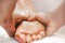 Close-up view masseur hands doing feet massage. Selective focus