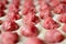 Close-up view of the meat balls laying on the rolled out wheat dough. Dumplings cooking.