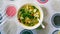 The close up view of the mixed vegetables soup with soo hoon noodles in a bowl