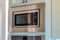 Close up view of modern electric microwave oven inside the kitchen of a home