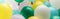 Close up view of multicolored party decorative balloons, panoramic shot.