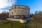 Close up view of Munot fortification from backyard with green grass surrounded by vineyard in center of Schaffhausen city center