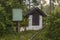 Close up view of old abounded building in forest. .