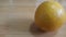 Close up view of oranges on wooden floor with wooden background