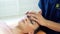 Close Up view of osteopath healing head of woman