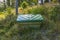 Close up view of outdoor plastic green storage box near private white house