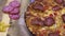 Close up view over rotating pizza salami