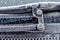 Close-up view of part of a windshield wiper blade assembly seen frosted up during cold weather.