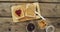 Close up view of peanut butter and jelly sandwich on wooden tray on wooden surface