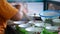 Close-up view of a penjual mie ayam bakso or meatball chicken noodle seller who is making chicken noodles