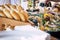 Close up view of people firends hands taking food from catering table during party celebration - food on a table -coloured backgro