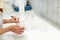 Close up view of a pharmacist in the laboratory mixing a medical ointment in a bowl