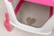 Close up view of pink cat litter box