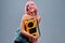 Close-up view portrait of nice attractive glamorous cheerful cheery positive comic woman with pink hair carrying boombox showing